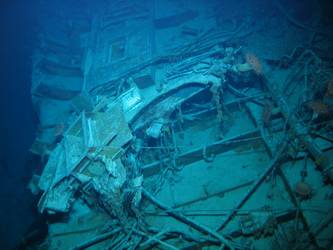 Unidentified wreckage on seabed, skylights visible. Jumble of wire.